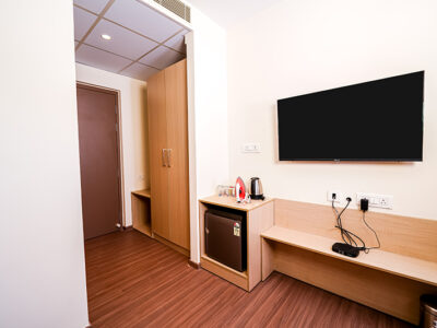 Cozy hotel room with modern amenities at Casa Hotel & Suites